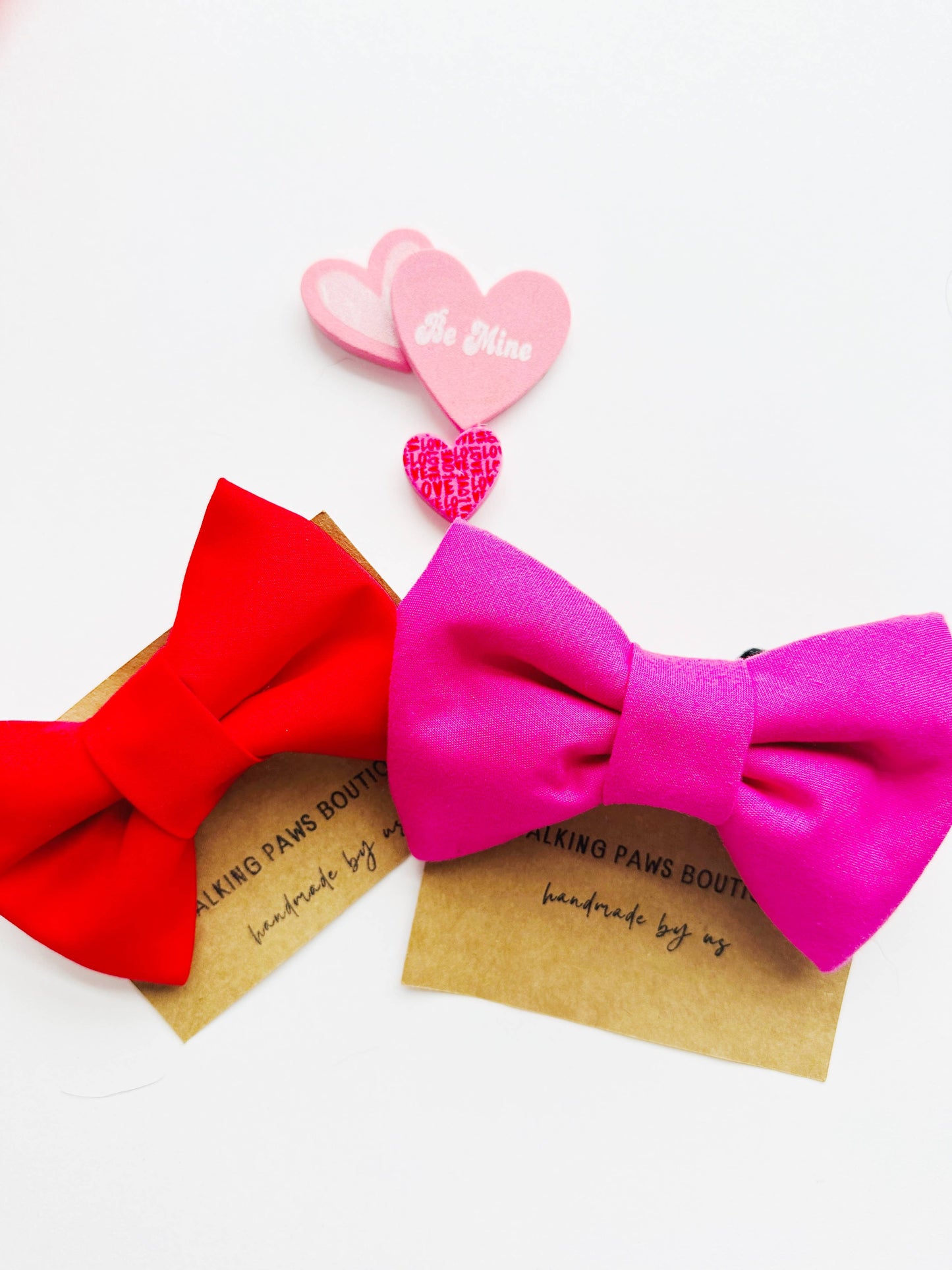 Bright pink bowtie for pets, attachable to most size collars