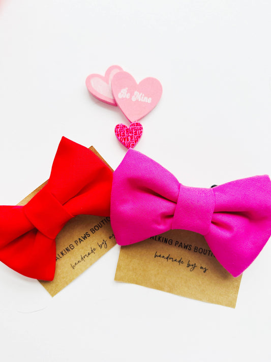 Bright pink bowtie for pets, attachable to most size collars